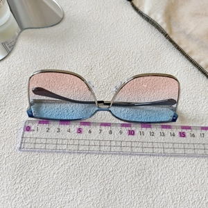 Metal frame kids sunglasses with gradient lenses shown with measuring ruler for size 14.5cm