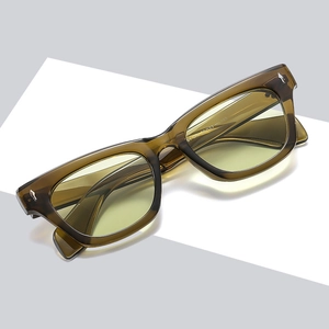 Stylish amber cat-eye sunglasses with yellow tinted lenses shown from a 45-degree angle
