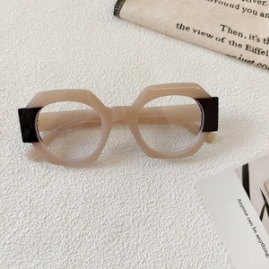 Detail shot of beige geometric eyewear frame showing 13160 48-26-144 temple markings