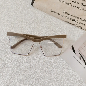 Detail of khaki semi-rimless glasses frame with unique V-shaped bridge and gold metal
