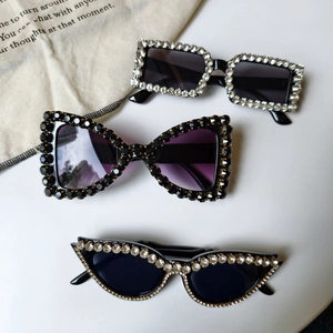Three styles of black oversized sunglasses with sparkling rhinestones for party fashion