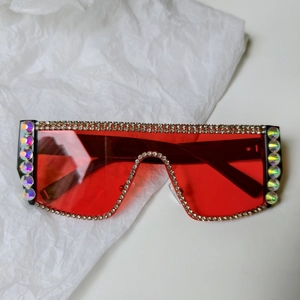 Detail of red square sunglasses with sparkling rhinestones and crystal pearls for bridal parties