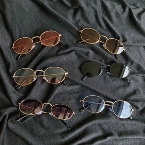 Retro oval metal frame sunglasses in six vibrant lens colors with UV protection