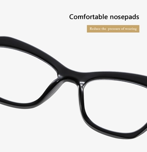 Detail of ergonomic integrated nose pads on black cat-eye glasses frame for comfort