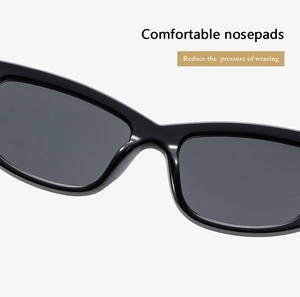 Detail of ergonomic integrated nosepads on rectangular sunglasses for pressure reduction