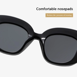 Close-up of comfortable integrated nose pads on black oval sunglasses to reduce pressure