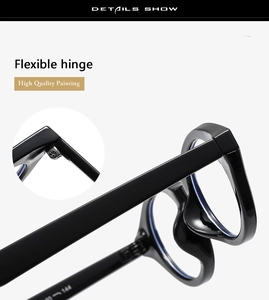 Detailed close-up of high-gloss black oval eyeglass frame with durable silver metal hinges