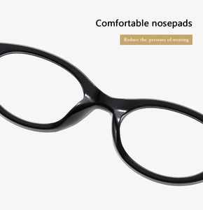 Close-up of comfortable integrated nose pads on black oval eyeglass frames