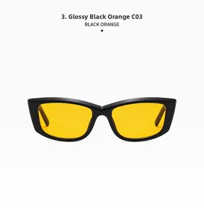 Detail view of rectangular cat-eye sunglasses with shiny black frame and orange lenses
