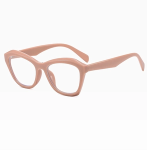 Detail view of pink cat-eye frame glasses with thick geometric design and smooth texture