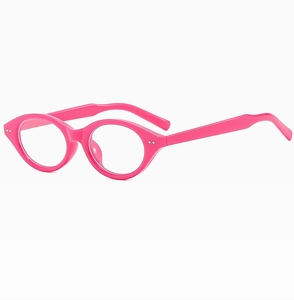 Macro shot of stylish pink cat-eye frame glasses focusing on smooth glossy resin texture