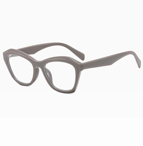 Close-up of glossy dark grey cat-eye frames with thick geometric rims and smooth finish