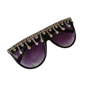 Oversized black square sunglasses with purple gradient lenses and rhinestone tassels
