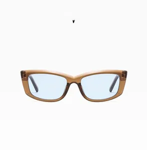 Detailed front view of rectangular cat eye sunglasses in amber with light blue lenses