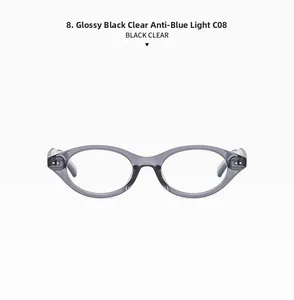 Detail of glossy black oval glasses frame with anti-blue light clear lenses and metal rivets
