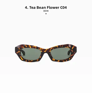 Détail macro de lunettes œil-de-chat avec monture écaille marron et verres vert foncé