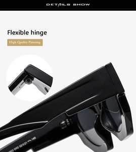 Detail of trendy black sunglasses showing high-quality flexible hinge and glossy finish