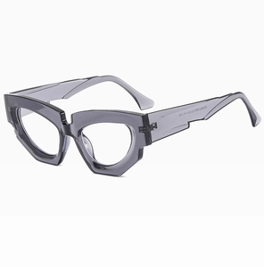 Macro shot of grey transparent geometric sunglasses frame with ZN3922 model engraving