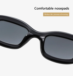 Détail des plaquettes de nez intégrées sur lunettes de soleil ovales pour plus de confort