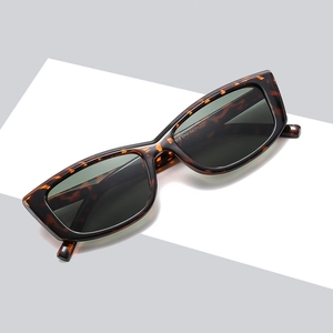 Retro rectangular tortoise shell sunglasses with dark lenses on a geometric background