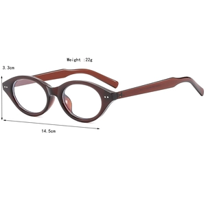 Vintage oval cat eye glasses in dark brown tortoiseshell frame with silver stud accents