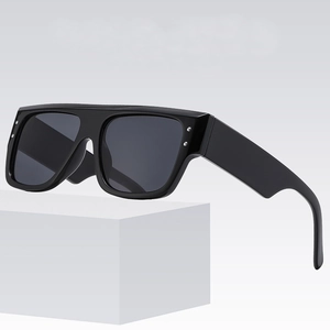 Oversized flat top square sunglasses in glossy black with silver rivet accents and grey lenses