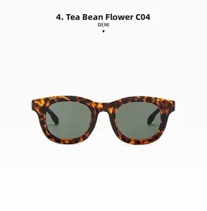 Close-up of tortoise shell sunglasses with dark lenses and vibrant amber textures