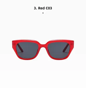 Detailed close-up of red rectangular sunglasses with dark grey lenses on white background