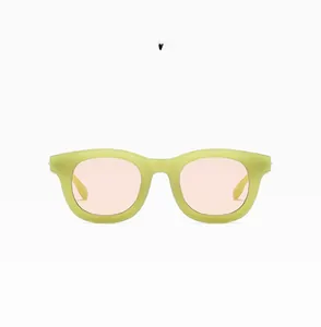 Detail view of jelly green translucent sunglasses frame with peach tinted lenses C05