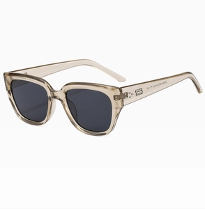 Detail shot of vintage square sunglasses with double B metal logo on transparent grey frame