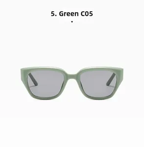 Detail of sage green square cat-eye sunglasses with grey lenses and rivet studs