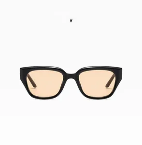 Detail of square black sunglasses frame with light brown lenses and rice nail rivets