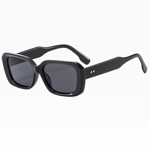 Detailed close-up of retro square sunglasses featuring elegant silver diamond rivet accents