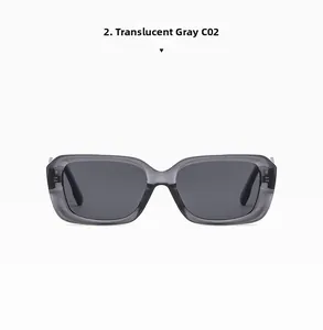 Detailed front view of transparent grey rectangular sunglasses with dark lenses