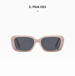 Detail view of pink rectangular sunglasses with dark lenses and glossy retro finish