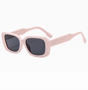 Detail showing pink rectangular sunglasses frame with silver diamond rivet decorations
