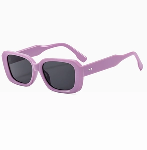 Detail view of purple rectangular retro sunglasses with silver diamond studs on the side