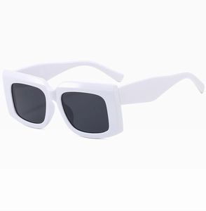Detail of vintage thick white square frame sunglasses with dark polarized lenses