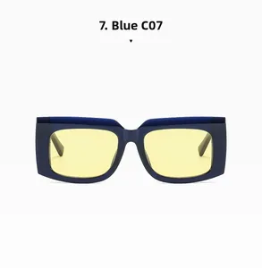 Detail of square vintage sunglasses with chunky blue frames and yellow tinted lenses