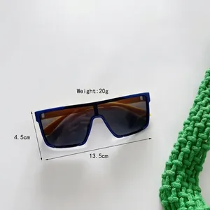 Lunettes de soleil oversize pour enfants avec monture bleu-orange et verres gris