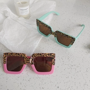 Kids leopard print square sunglasses in pink and mint green with UV protection lenses