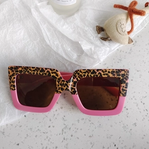 Detail of leopard print and pink patchwork frames on stylish kids square sunglasses