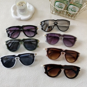 Collection of retro square gradient sunglasses in various colors on a stylish white surface