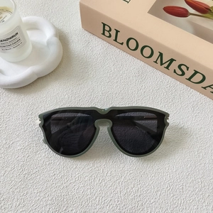 Close-up of stylish dark green oversized square frame sunglasses with UV lenses