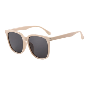 Chic cream-colored oversized sunglasses with dark lenses and silver metal accents