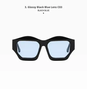 Detail of irregular cat-eye sunglasses with glossy black frames and light blue lenses
