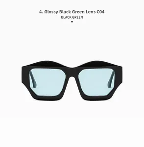 Detail view of bold black cat-eye sunglasses featuring transparent green lenses and thick frame