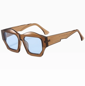 Close-up of translucent brown geometric frame sunglasses with blue lenses and model details