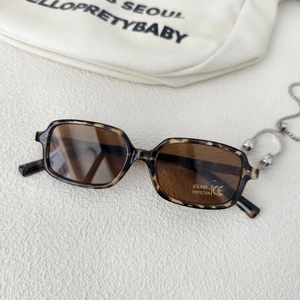 Detailed close-up of leopard print retro square sunglasses with UV400 CE protection lenses