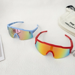 Detail of blue and red kids sports sunglasses with colorful mirrored lenses on white surface